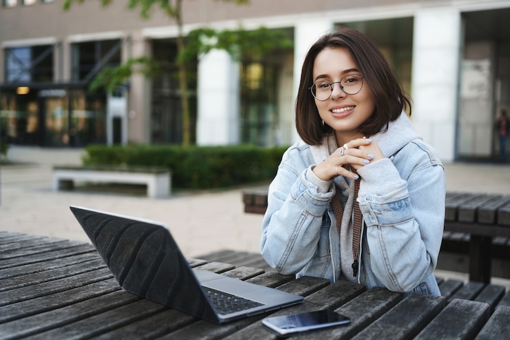 public/uploads/2022/02/freelance-people-education-concept-cheerful-young-attractive-girl-sitting-alone-park-bench-university-working-remote-with-laptop-mobile-phone-look-away-with-pleased-smile_197531-22155.jpg