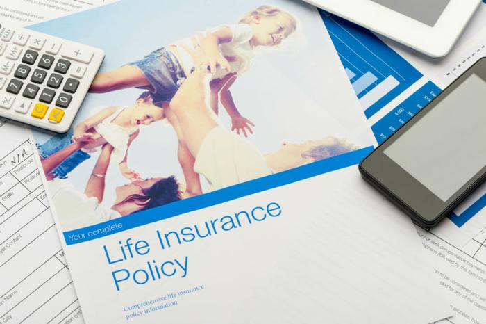 public/uploads/2022/06/Life_insurance_policy_and_paperwork_courtneyk_Getty_Images_large.jpg