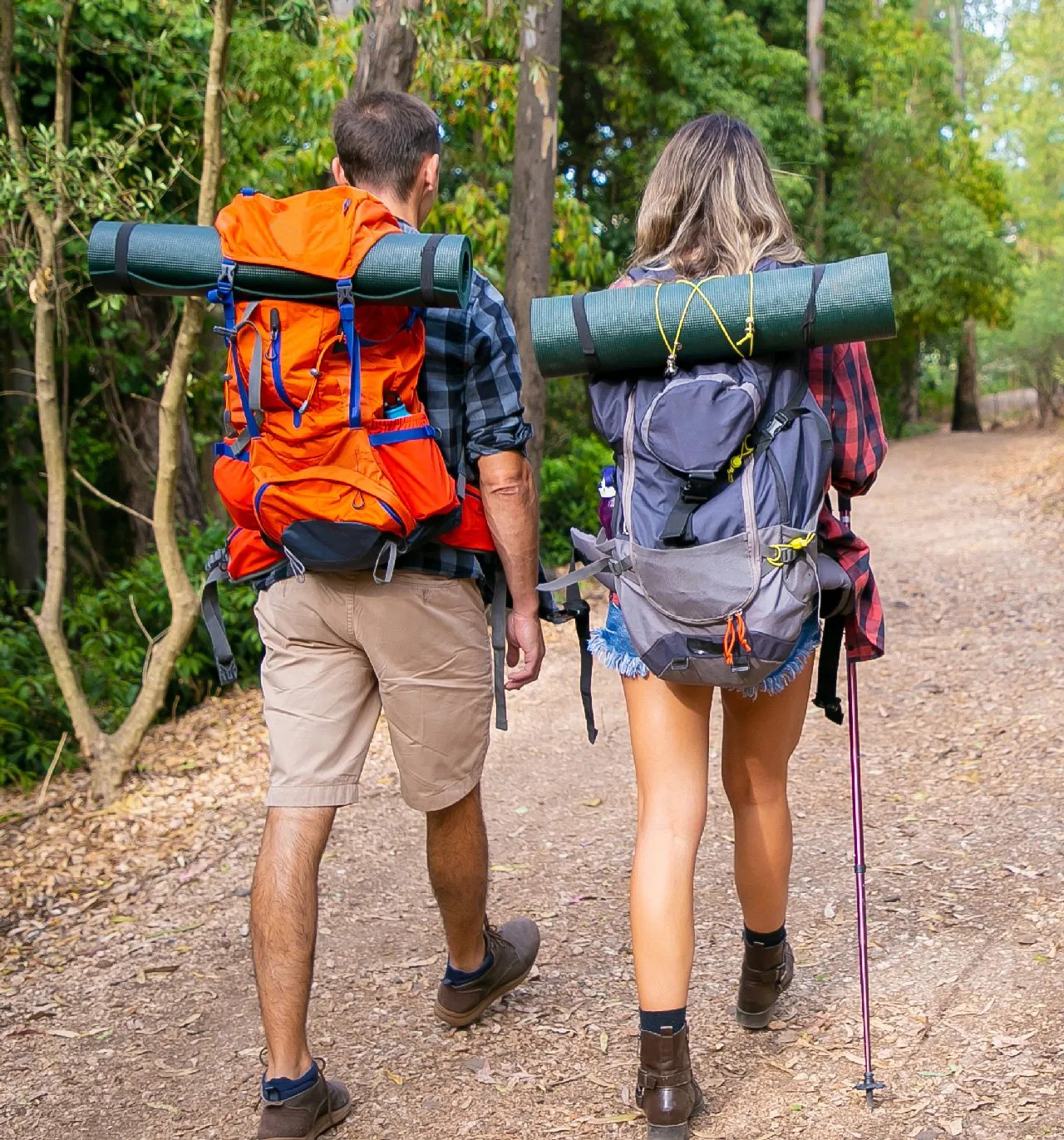 public/uploads/2022/07/back-view-couple-going-along-road-forest-long-haired-woman-man-carrying-backpacks-hiking-nature-toge.jpg